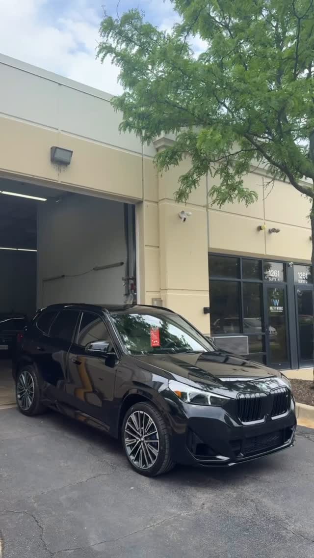 Black BMW SUV outside the boutique after paint correction